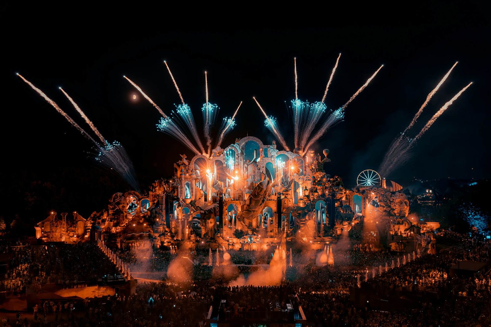 Tomorrowland mainstage lit by fireworks at night