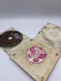 The Arising of Life CD, Tomorrowland 2010 festival collectible, detail view